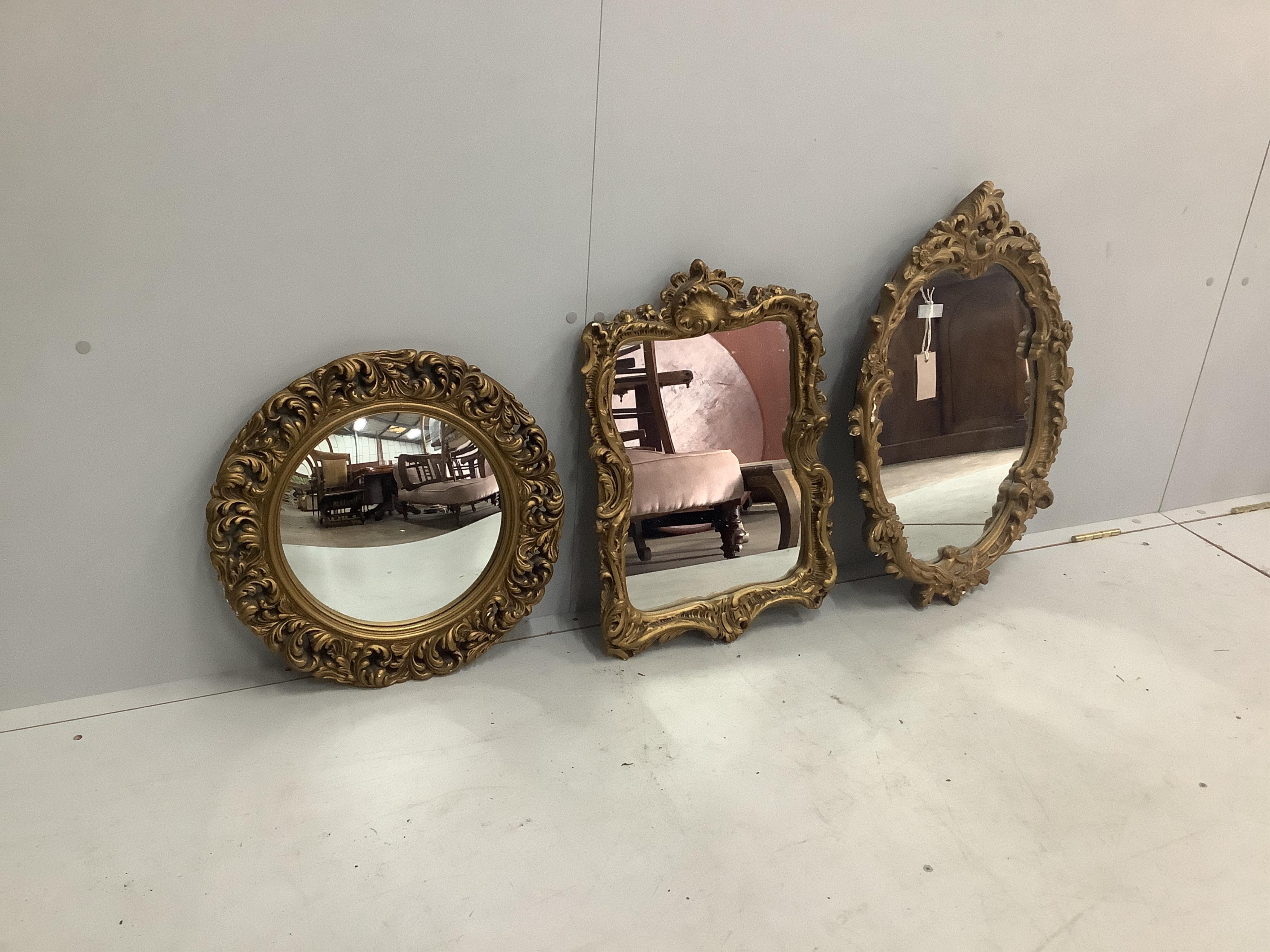 Three Victorian style gilt composition wall mirrors, one convex, largest width 45cm, height 65cm. Condition - fair